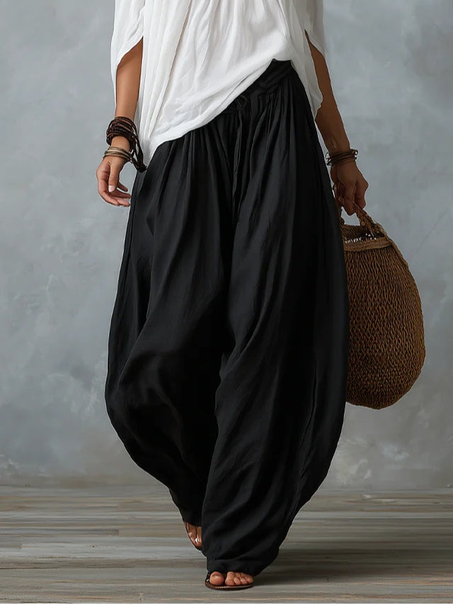 Mara • Conjunto blusa blanca hombros descubiertos y pantalón palazzo negro