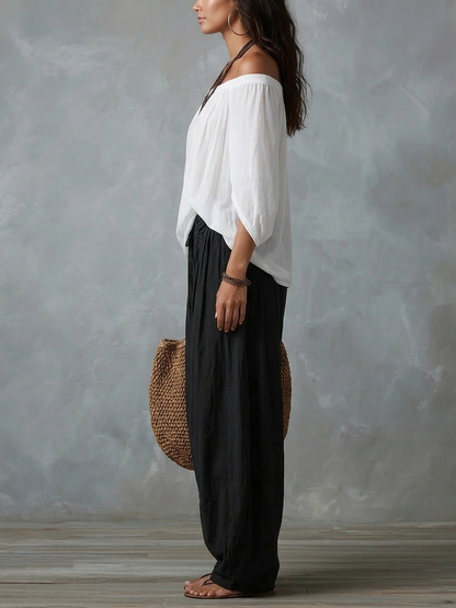 Mara • Conjunto blusa blanca hombros descubiertos y pantalón palazzo negro